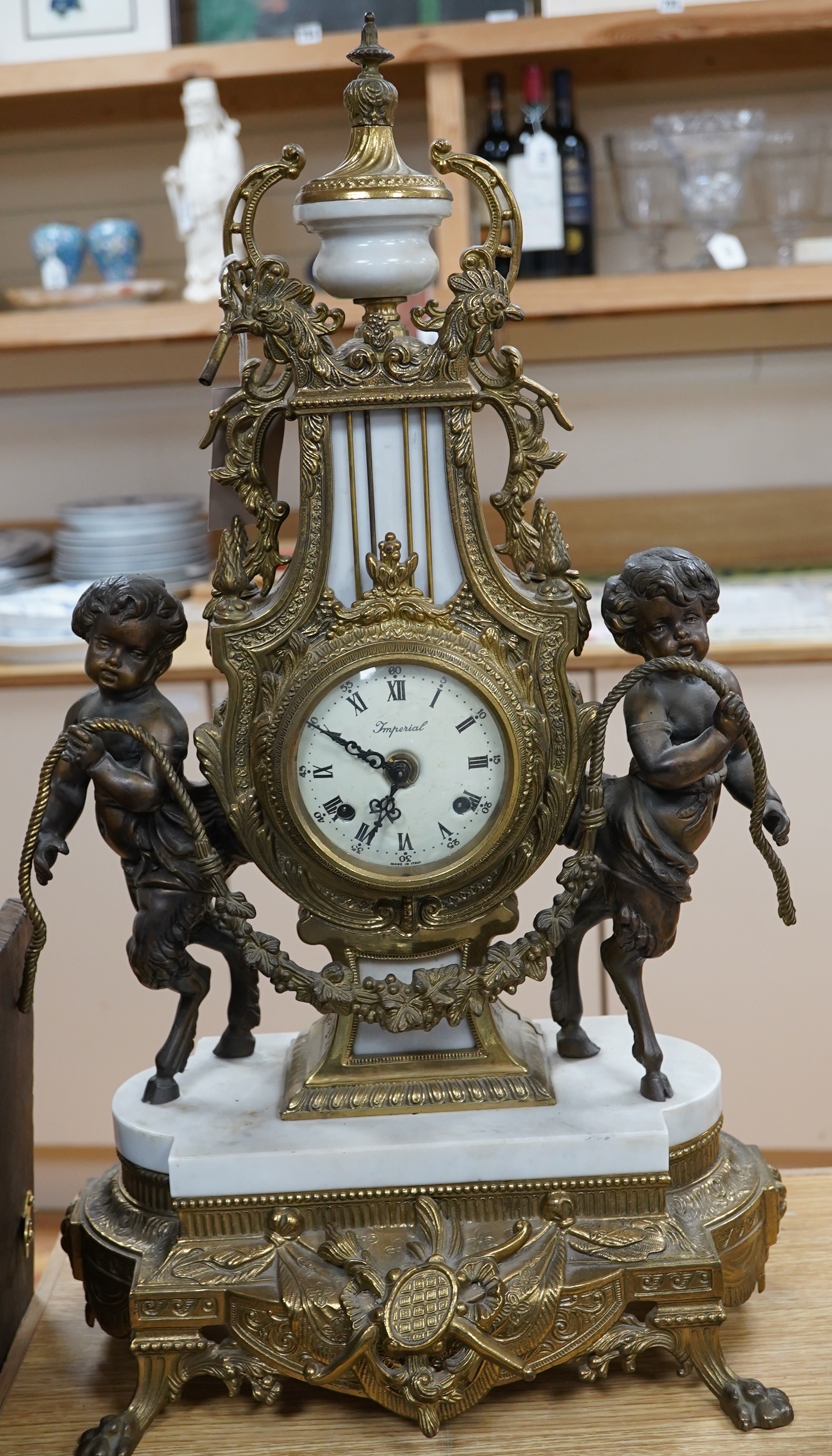 A Louis XV style brass and marble mantel clock, with key, 60cm tall. Condition - good